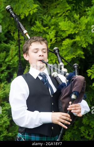 Boy playing the bagpipes, Scotland Stock Photo