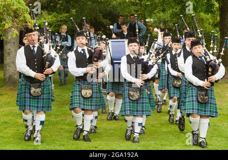 Pipe band playing during a competition, Scotland Stock Photo