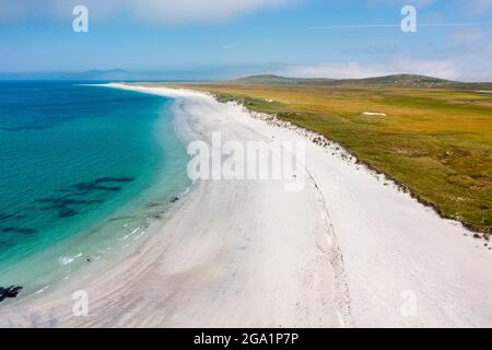 Aerial view from drone of white sand beach on west coast of island of Berneray in the Outer Hebrides, Scotland, UK Stock Photo