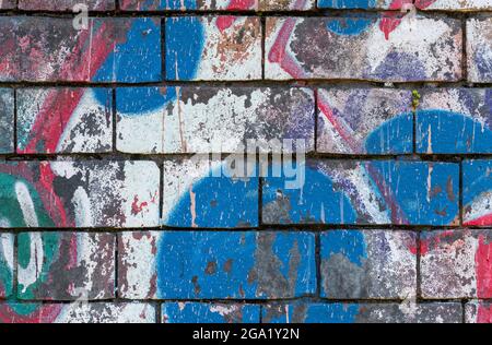 red white and blue patriotic graffiti on a brick wall in an abstract british design. Stock Photo