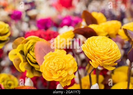 paper made artificial colored flowers, handicrafts on display in Handicraft Fair in Kolkata - the biggest handicrafts fair in Asia. Stock Photo