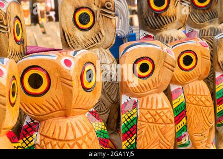 Wooden owls, artworks of handicraft, on display during Handicraft Fair in Kolkata - the biggest handicrafts fair in Asia. Stock Photo