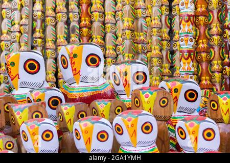 Wooden owls, artworks of handicraft, on display during Handicraft Fair in Kolkata - the biggest handicrafts fair in Asia. Stock Photo