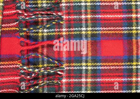 Checkered quilt texture in predominant red color. Fabric background. Stock Photo