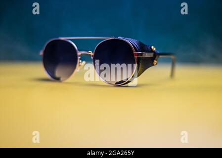 steampunk sunglasses with leather inserts on a dark background Stock Photo