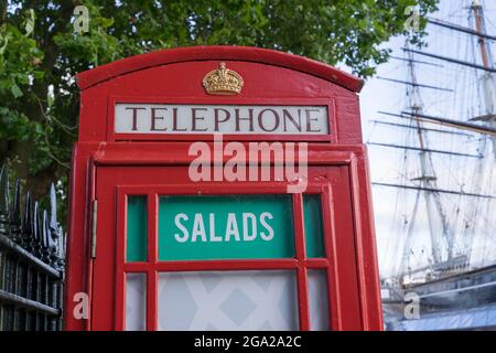 Salads ad on red telephone box in London England Stock Photo