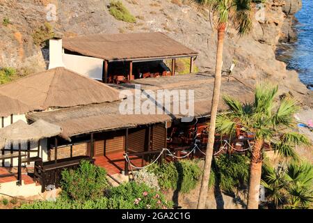 Beautiful restaurant at Cala del Barco cove in Atamaria, Cartagena province, Spain on a sunny day of summer Stock Photo