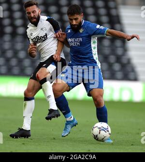 Derby County's Graeme Shinnie and Real Betis' Nabil Fekir (right) battle for the ball during the pre-season friendly match at the Pride Park Stadium, Derby. Picture date: Wednesday July 28, 2021. Stock Photo