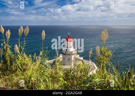 The Farol do Arnel Lighthouse at Ponta do Arnel near Nordeste overlooking the Atlantic Ocean; Sao Miguel Island, Azores Stock Photo