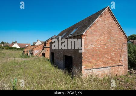 Old brick farm building ready for renovation Stock Photo