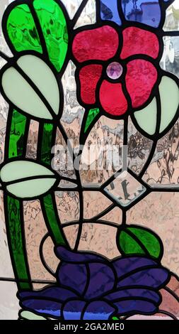 Abstract of stained glass window featuring a rose Stock Photo