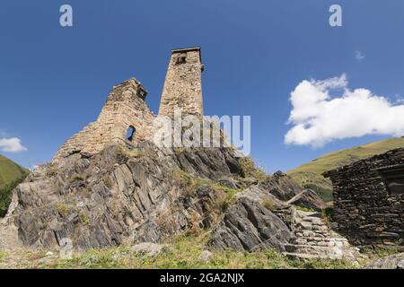 Stone tower ruins of Sno Castle, built on top of a rocky cliff in the village of Sno in the Kazbegi District; Sno, Kazbegi, Georgia Stock Photo