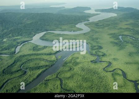 Aerial view of the Sierpe River and surrounding wetlands, where the river empties into Drake Bay and the Pacific Ocean; Puntarenas, Costa Rica Stock Photo