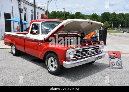 A 1966 F100 Ford Pickup Truck on display at a car show. Stock Photo