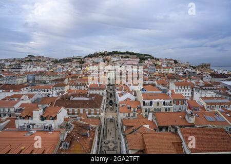 Overview of the Old Town of Portugal's capital city of Lisbon with its pastel colored buildings and clay tiled rooftops and St George's Castle (Cas... Stock Photo