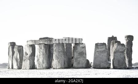 Black and white image of Stonehenge defined by early morning snow; Wiltshire, England Stock Photo