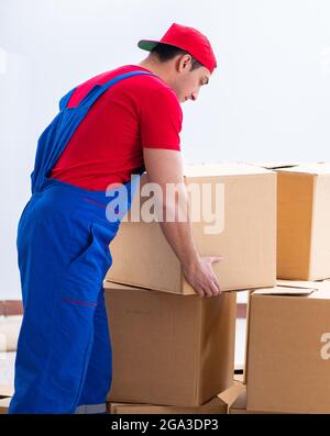 The contractor worker moving boxes during office move Stock Photo