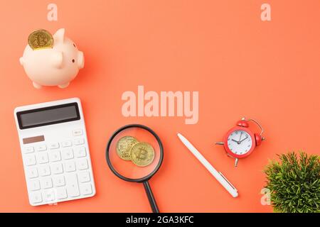 Piggy bank with calculators office desk top view. Stock Photo