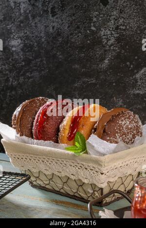 Bolas de Berlim, or "Berlin Balls". Portuguese fried dough with sugar, Filled with sweet cream. Stock Photo