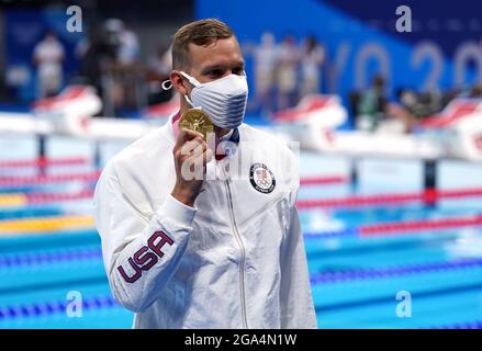 TOKYO, JAPAN - JULY 29: Caeleb Dressel of United States shows the gold ...