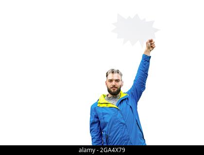 Young inspired man holding blank speech bubble over head on white background, having idea, want to speak. Stock Photo