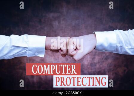 Text sign showing Computer Protecting. Conceptual photo protecting computer against unauthorized intrusions Two Professional Well-Dressed Corporate Stock Photo