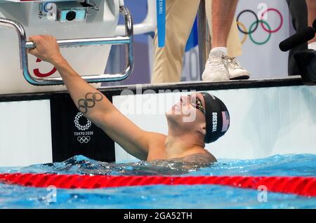 TOKYO, JAPAN - JULY 29: Caeleb Dressel of United States shows the gold ...