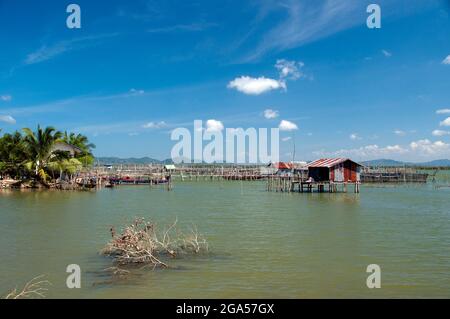 Thailand: Fish farms play an important role for communities near Ko Yo (Yo Island), Thale Sap Songkhla (Songkhla Lake). Songkhla was the seat of an old Malay Kingdom with heavy Srivijayan influence. In ancient times (200 CE - 1400 CE), Songkhla formed the northern extremity of the Malay Kingdom of Langkasuka. The city-state then became a tributary of Nakhon Si Thammarat, suffering damage during several attempts to gain independence. Stock Photo