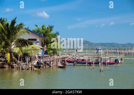 Thailand: Fish farms play an important role for communities near Ko Yo (Yo Island), Thale Sap Songkhla (Songkhla Lake). Songkhla was the seat of an old Malay Kingdom with heavy Srivijayan influence. In ancient times (200 CE - 1400 CE), Songkhla formed the northern extremity of the Malay Kingdom of Langkasuka. The city-state then became a tributary of Nakhon Si Thammarat, suffering damage during several attempts to gain independence. Stock Photo