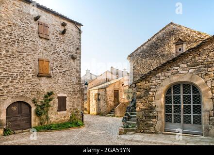 Street in medieval fortified town of La Couvertoirade, Causse du Larzac, commune in Aveyron department, Causses region, Occitanie region, France Stock Photo
