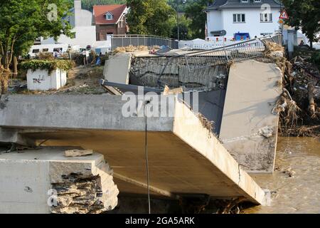 Bad Neuenahr Ahrweiler, Germany. 22nd July, 2021. A destroyed bridge can be seen over and in the river Ahr. Numerous bridges were destroyed in the area. Credit: Bodo Marks/dpa/Bodo Marks/dpa/Alamy Live News Stock Photo