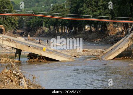 Bad Neuenahr Ahrweiler, Germany. 22nd July, 2021. A destroyed bridge can be seen over and in the river Ahr. Numerous bridges were destroyed in the area. Credit: Bodo Marks/dpa/Bodo Marks/dpa/Alamy Live News Stock Photo