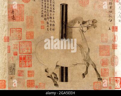 China: 'Night-Shining White'. Zhao Ye Bai, a favourite horse of Emperor Xuanzong (712-56). Handscroll painting by Han Gan (706-783), c. 750 CE.  Emperor Xuanzong of Tang (8 September 685-3 May 762), also commonly known as Emperor Ming of Tang (Tang Minghuang), personal name Li Longji, known as Wu Longji, was the seventh emperor of the Tang dynasty in China, reigning from 712 to 756. His reign of 43 years was the longest during the Tang Dynasty. In the early half of his reign he was a diligent and astute ruler, ably assisted by capable chancellors like Yao Chong and Song Jing. Stock Photo