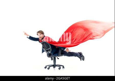 business man with red cloak trying in superman office chair Stock Photo ...