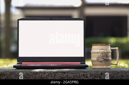 Laptop with blank screen on the Table Stock Photo