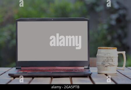 Laptop with blank screen on the Table Stock Photo