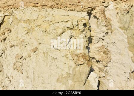 Land structure in open pit mining. Ground background in quarry. Rock texture during earthworks. Sand background and Earth's crust. Stock Photo