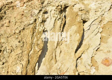 Land structure in open pit mining. Ground background in quarry. Rock texture during earthworks. Sand background and Earth's crust. Stock Photo