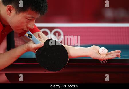 Tokio, Japan. 29th July, 2021. Table Tennis: Olympics, Preliminary Match, Singles, Men, Semifinals, Ovtcharov (Germany) - Long (China) at Tokyo Metropolitan Gymnasium. Ma Long on serve. Credit: Friso Gentsch/dpa/Alamy Live News Stock Photo