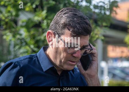 Salford, UK. 28th July, 2021. Andy Burnham, mayor of Greater Manchester seen taking a call during his visit to Salford Royal Hospital to check how hospitals are coping in the pandemic. (Photo by Ryan Jenkinson/SOPA Images/Sipa USA) Credit: Sipa USA/Alamy Live News Stock Photo