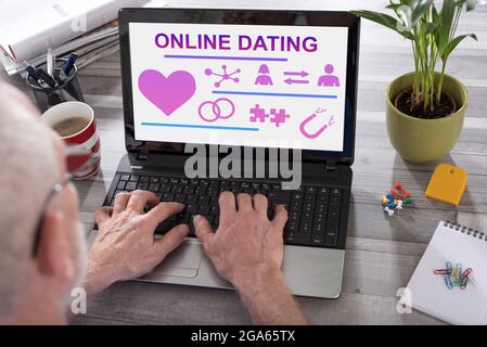 Online dating concept shown on a laptop used by a man Stock Photo