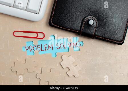 Conceptual display Problem Solving. Word for process of finding solutions to difficult or complex issues Building An Unfinished White Jigsaw Pattern Stock Photo