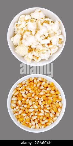 Popped and unpopped popcorn, in white bowls, over gray. Butterfly shaped popcorn, puffed up from heated kernels, and seeds of a special type of corn. Stock Photo