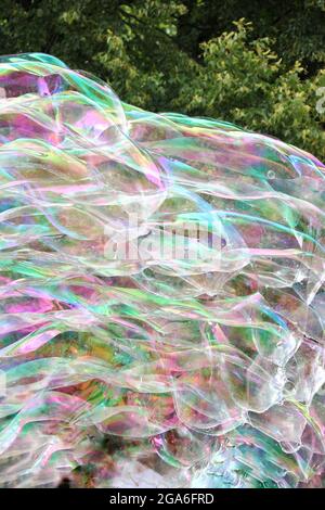 Huge bubbles floating thru the air on a beautiful summer day. Stock Photo