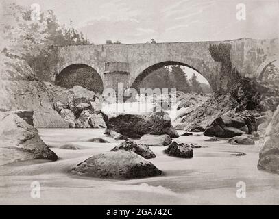 A late 19th century view of Invercauld Bridge, also known as Bridge of Dee crosses the River Dee near Invercauld, between Crathie (Balmoral) and Braemar on the A93 road. The Old Bridge dating back to 1753 was built by Major Caulfeild as part of the military road from Perthshire through the mountains to Speyside. Stock Photo