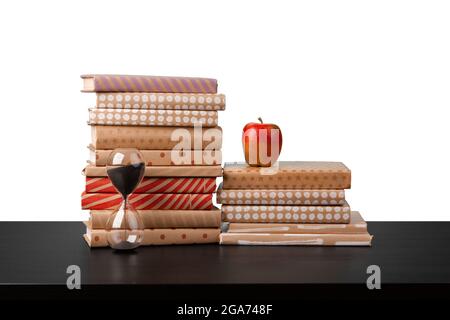 Book Stack With Ruler Apple Stack of books and apple on tabletop against white background Stock ...