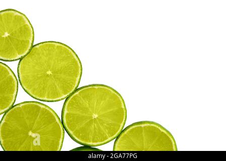 Round slices of lime isolated on white background, top view. Stock Photo