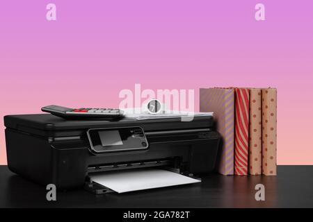 Compact home laser printer against pink background Stock Photo