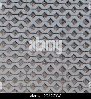 Geometric Concrete Of Parking Whith Green Grass. Grey Concrete Tile With Cells Of Eco Parking With Hole For Grass, Top View. Stock Photo