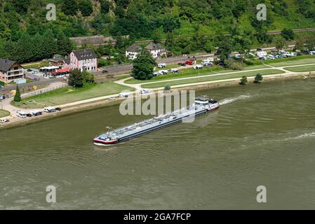 Loreley, Germany - 25 July 2021. A large tanker ship sailing in Germany on the Rhine River. Transportation of oil, gas and gasoline. Stock Photo